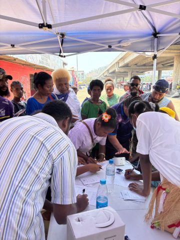 SOHS nursing team supporting SOHET in doing basic health check at Erima bridge
